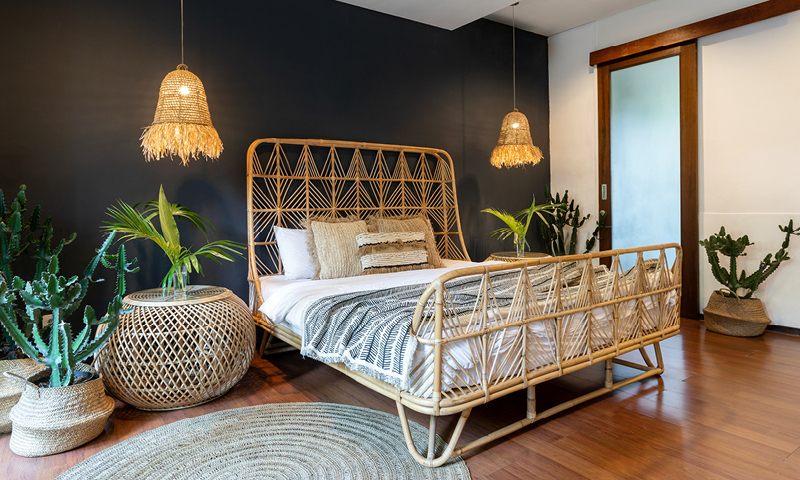 Bedroom with bamboo wooden furniture and hanging bamboo lights