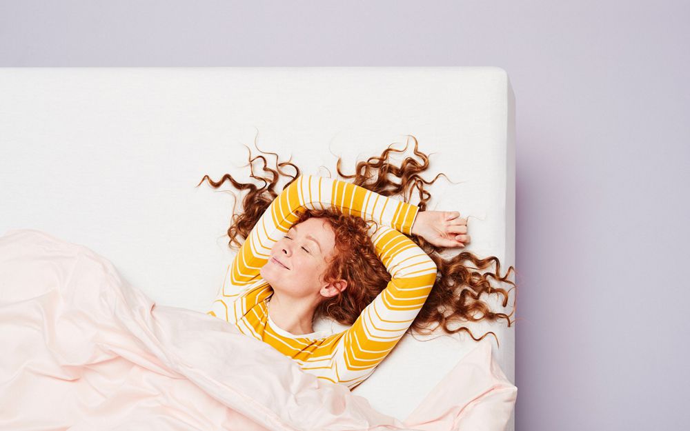 Woman sleeping on a mattress