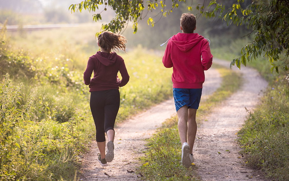 A couple jogging in a park