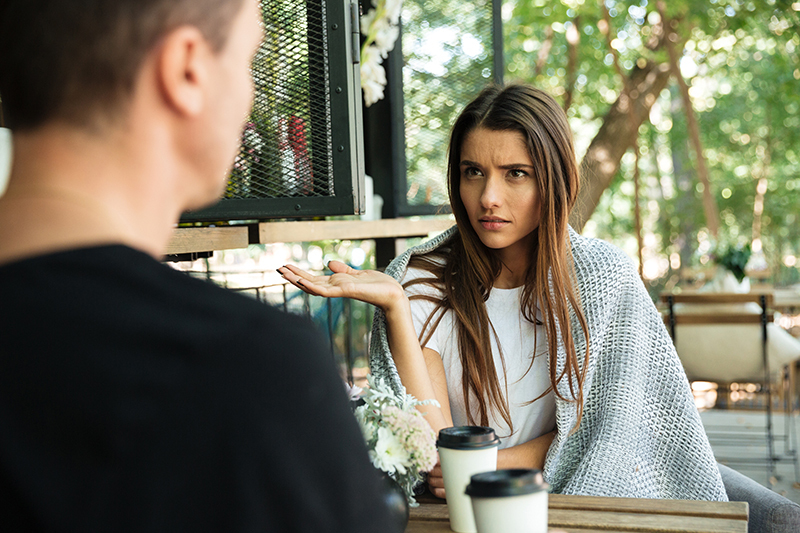 Couple with woman looking confused