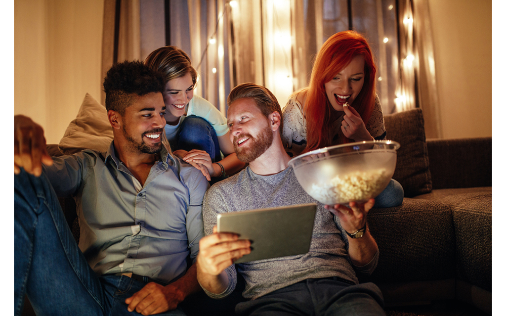 A group of friends watching a romantic film together