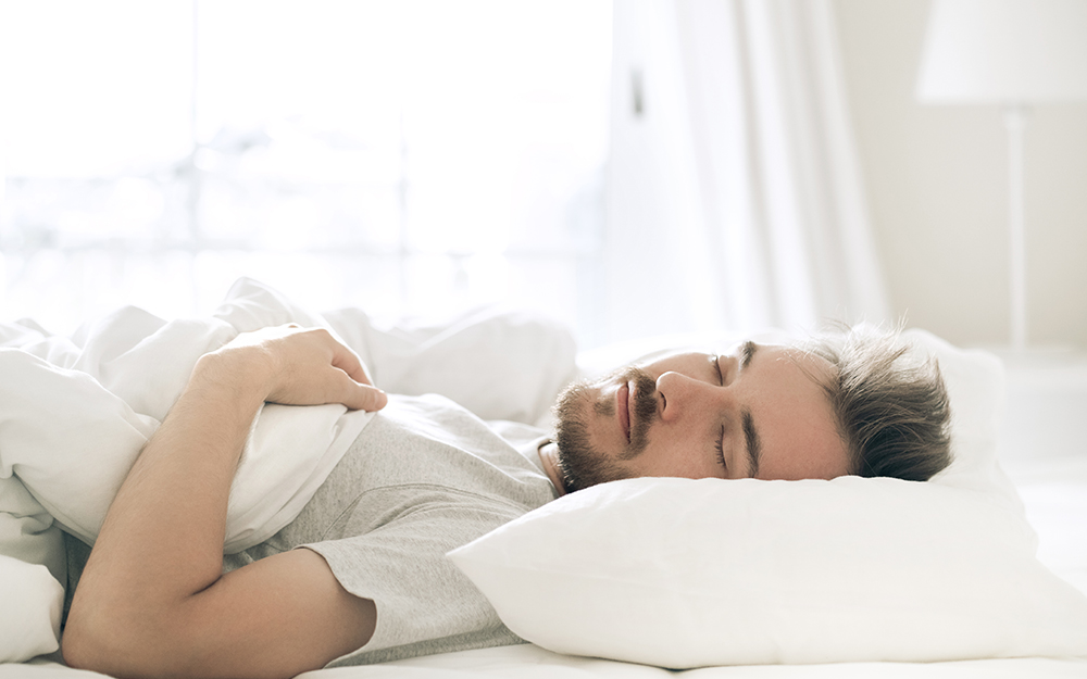 A man sleeping on his back