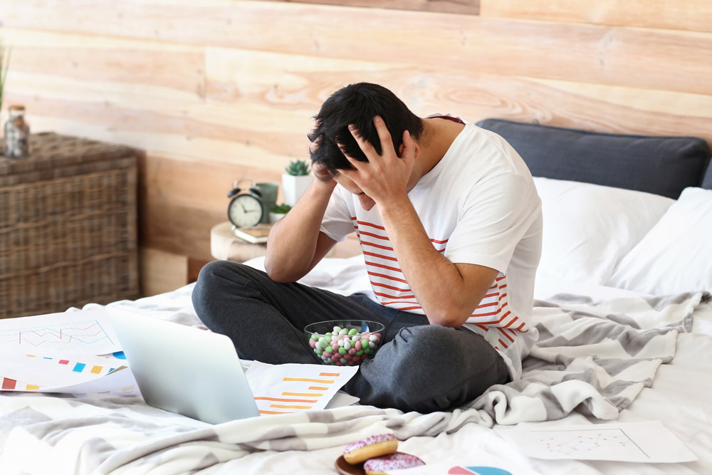 Man stressed and unable to concentrate on his work