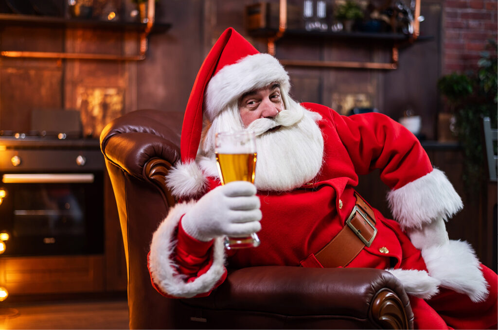 Santa drinking pint of beer