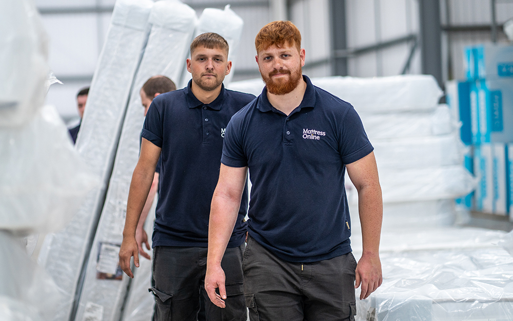 The MattressOnline warehousing team walking through the warehouse.