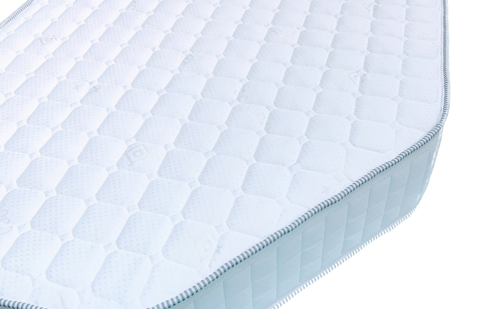 A close up of a right-hand cut caravan mattress