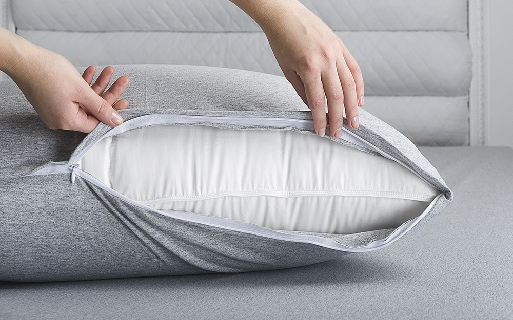 Person showing the inside of a pillow