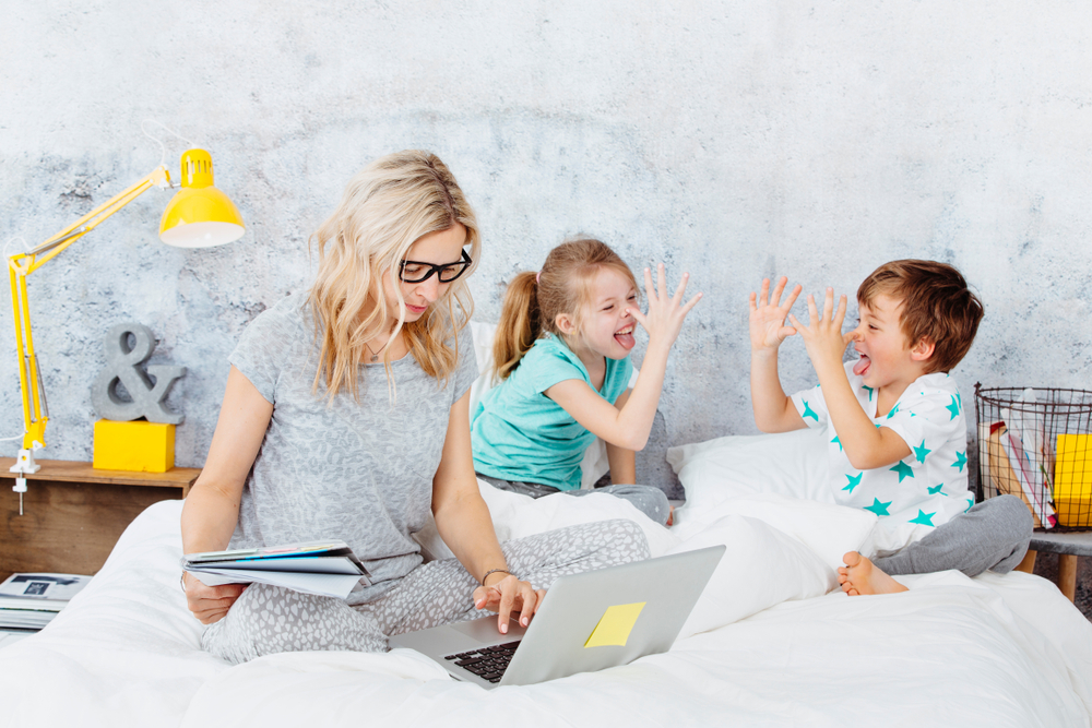 Mum and children on bed