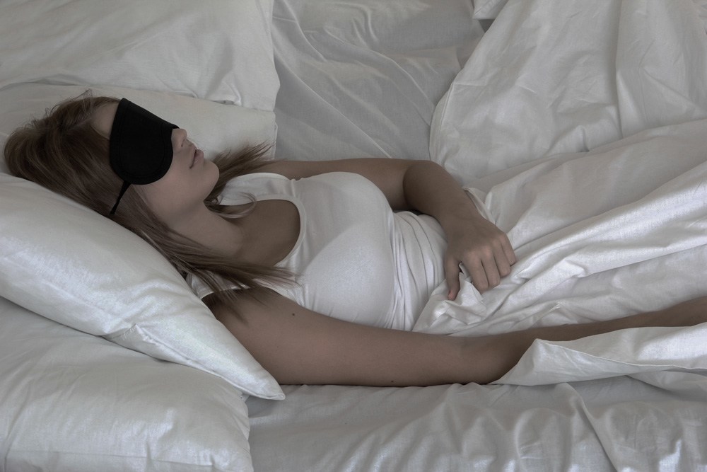 Woman wearing a sleep mask