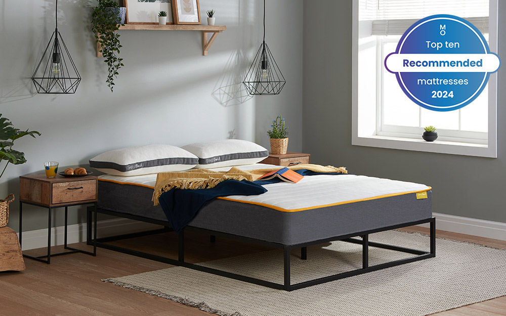 Image of the SleepSoul Comfort 800 Pocket Mattress on top of a black metal bed frame. Included in the image is a badge overlay stating that this mattress is one of Mattress Online's top ten recommended mattresses of 2024.