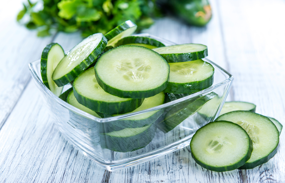 Sliced cucumbers in a glass bowl