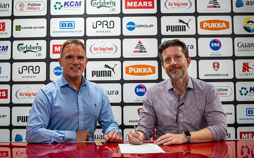 Steve Adams, CEO of Mattress Online, signing a partnership document with Steve Coakley, Commercial Director at Rotherham United