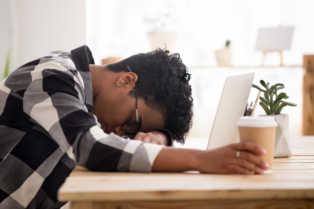 Boy asleep at desk while studying