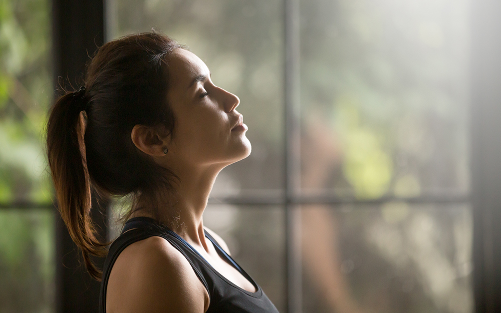 Woman breathing in deeply