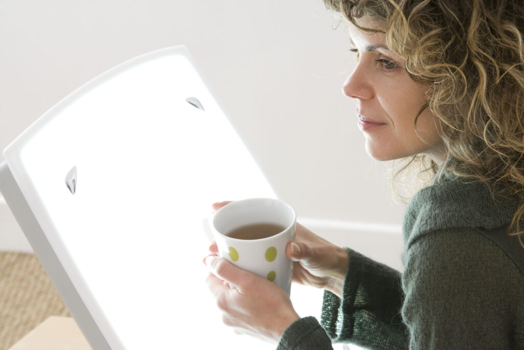 Woman sat in front of a light box