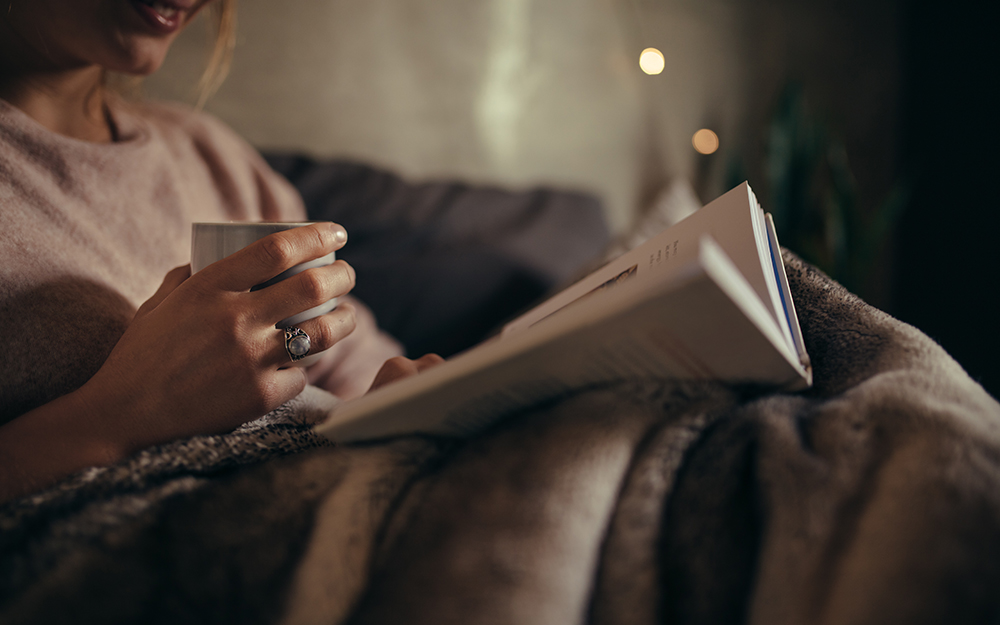 Woman reading in bed