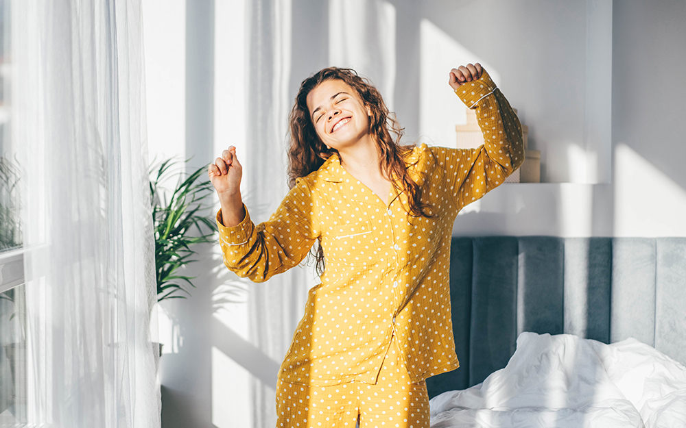 Woman smiling in pyjamas