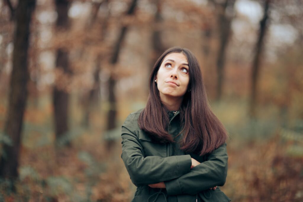 Woman standing in the woods